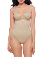 a woman wearing a nude sheer high waisted tummy control top thong panty shapewear