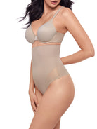 a woman wearing a nude sheer high waisted tummy control top thong panty shapewear