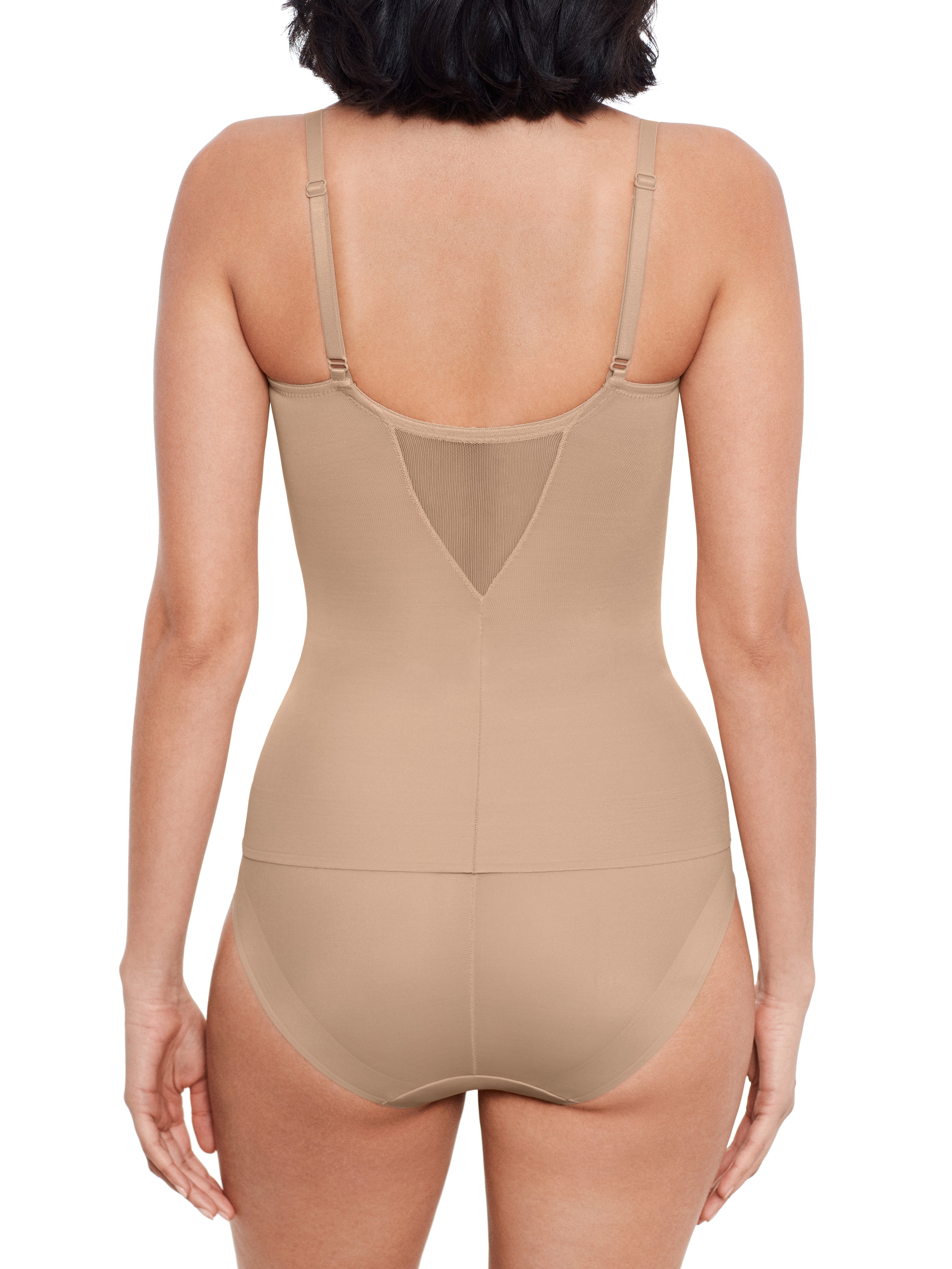 a woman wearing a nude sheer tummy control shaping cami body shaper shapewear