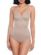 a woman wearing a nude sheer tummy control body shaper bodysuit shapewear