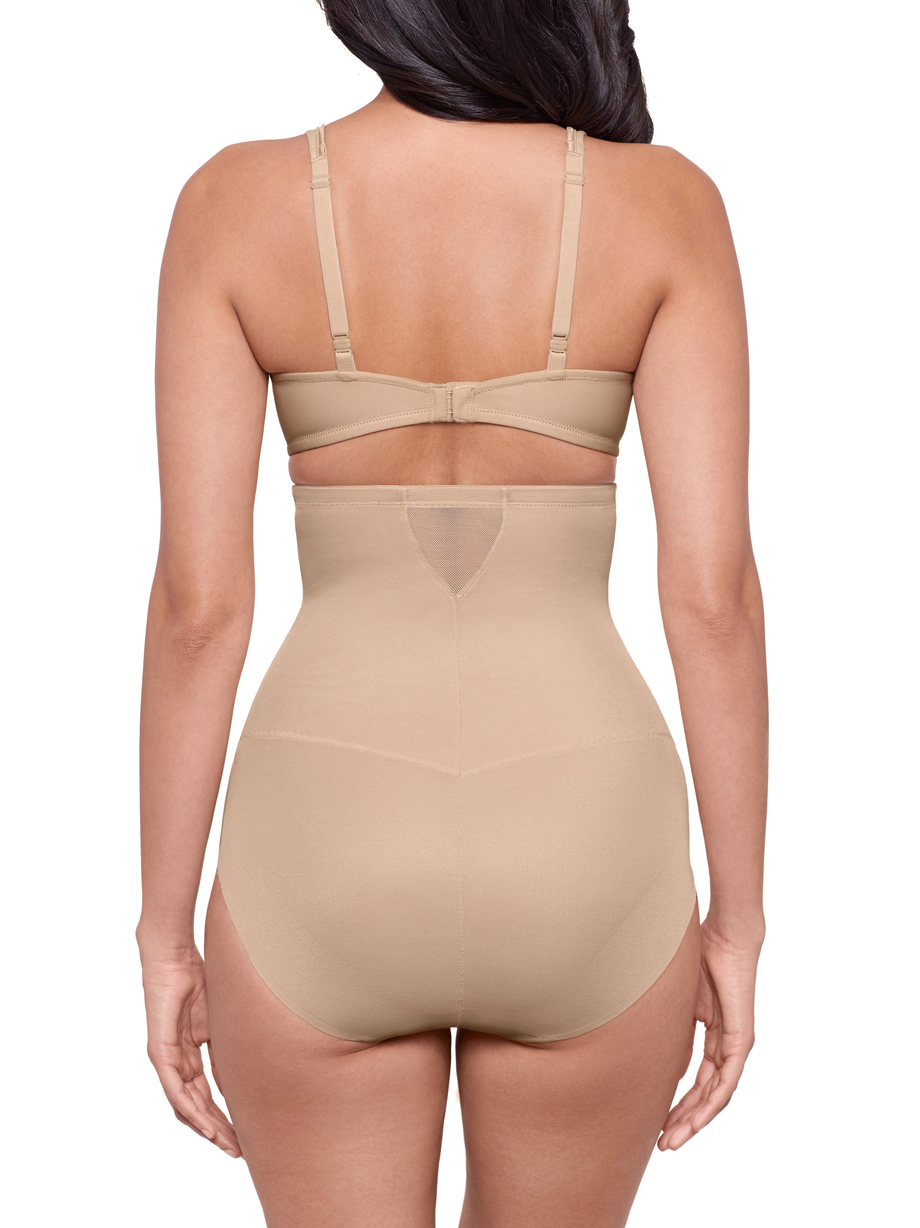 a woman wearing beige high waisted sheer shapewear tummy control brief