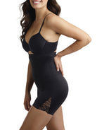 a woman wearing a black high waisted tummy control shapewear short with a lace detail