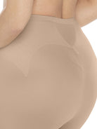 a closeup of a woman wearing a nude tummy control leggings shapewear