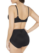 a woman wearing black tummy control underwear shapewear