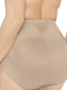 a detail closeup of a woman wearing nude tummy control underwear shapewear