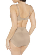 a woman wearing nude tummy control underwear shapewear