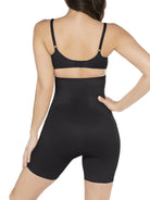 a woman wearing a black high waisted tummy control shapewear short