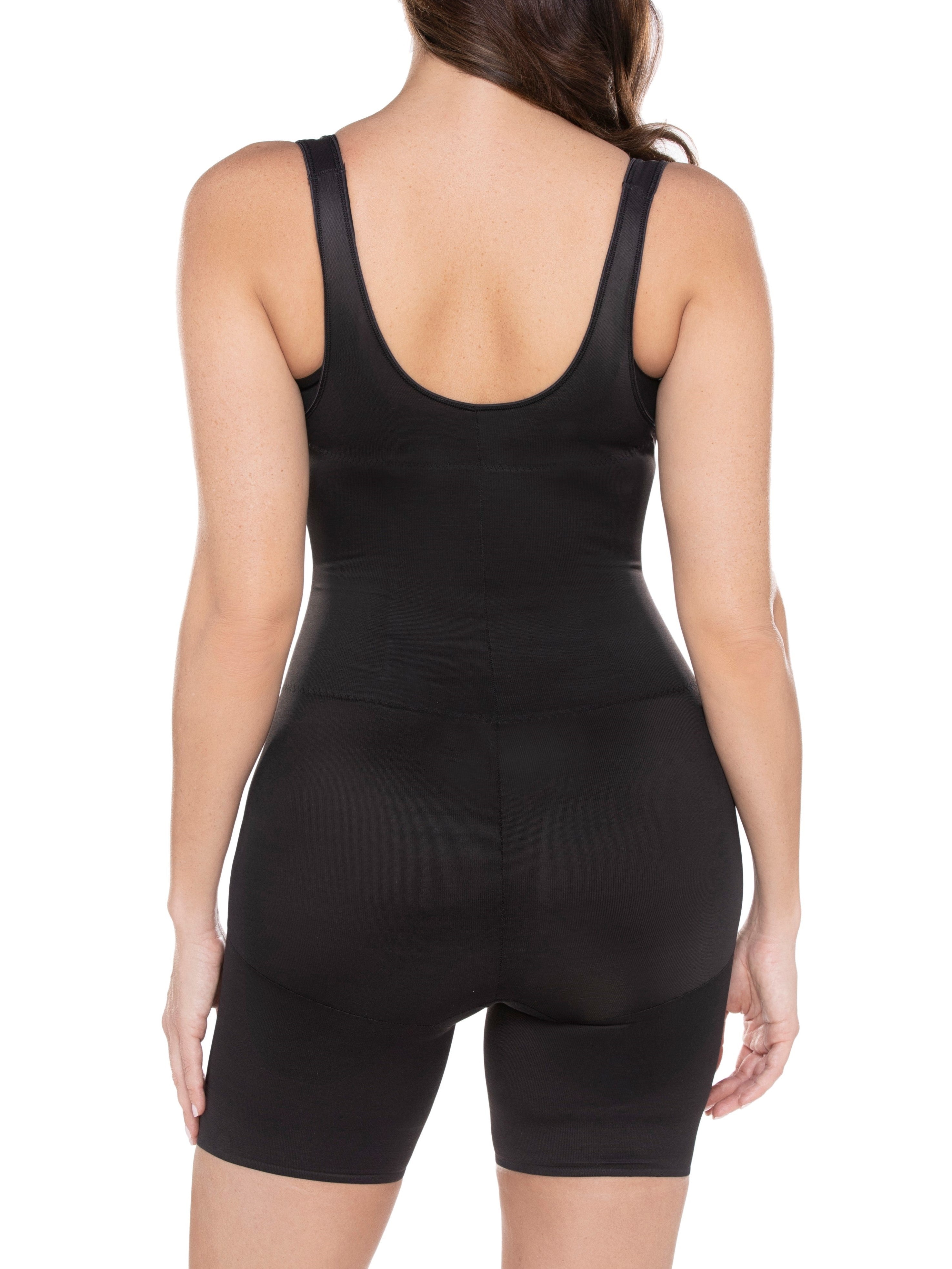 a woman wearing a black open-bust shaping bodysuit romper