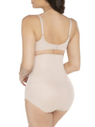 a woman wearing a beige shaping brief