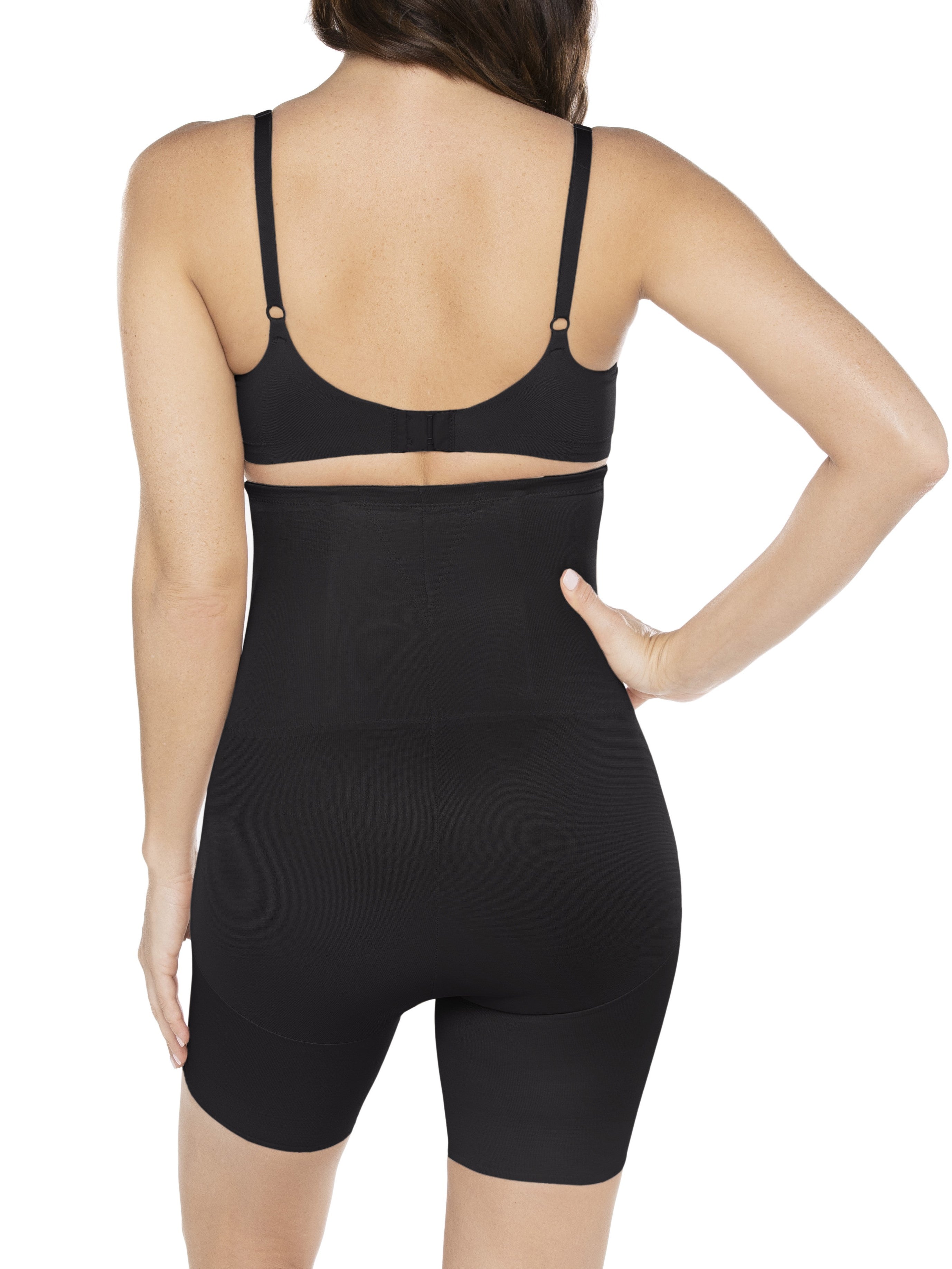 a woman wearing a black high waisted tummy control shapewear short