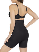 a woman wearing a black high waisted tummy control shapewear short