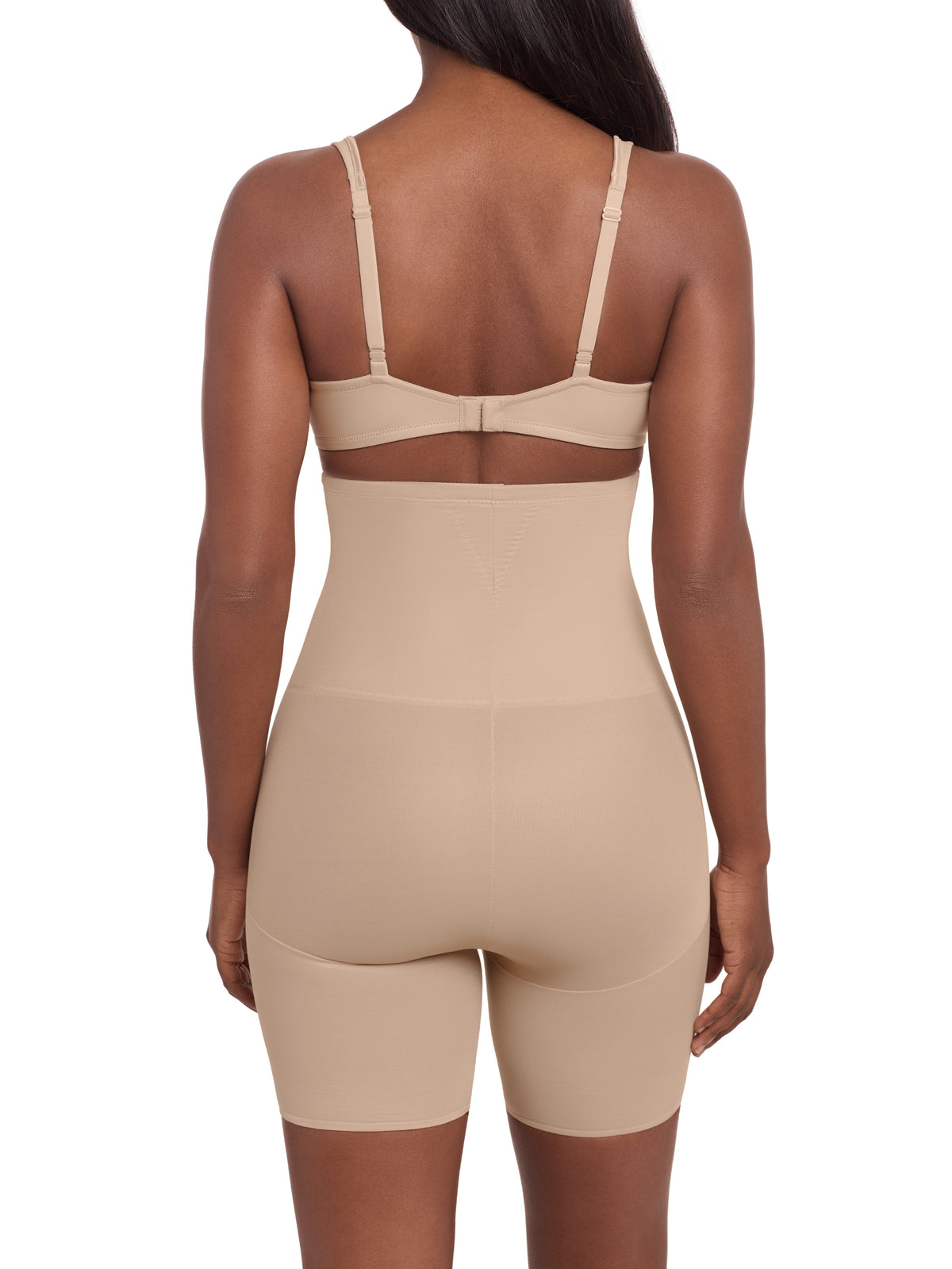 a woman wearing a beige high waisted tummy control shaping short thigh slimmer miraclesuit shapewear