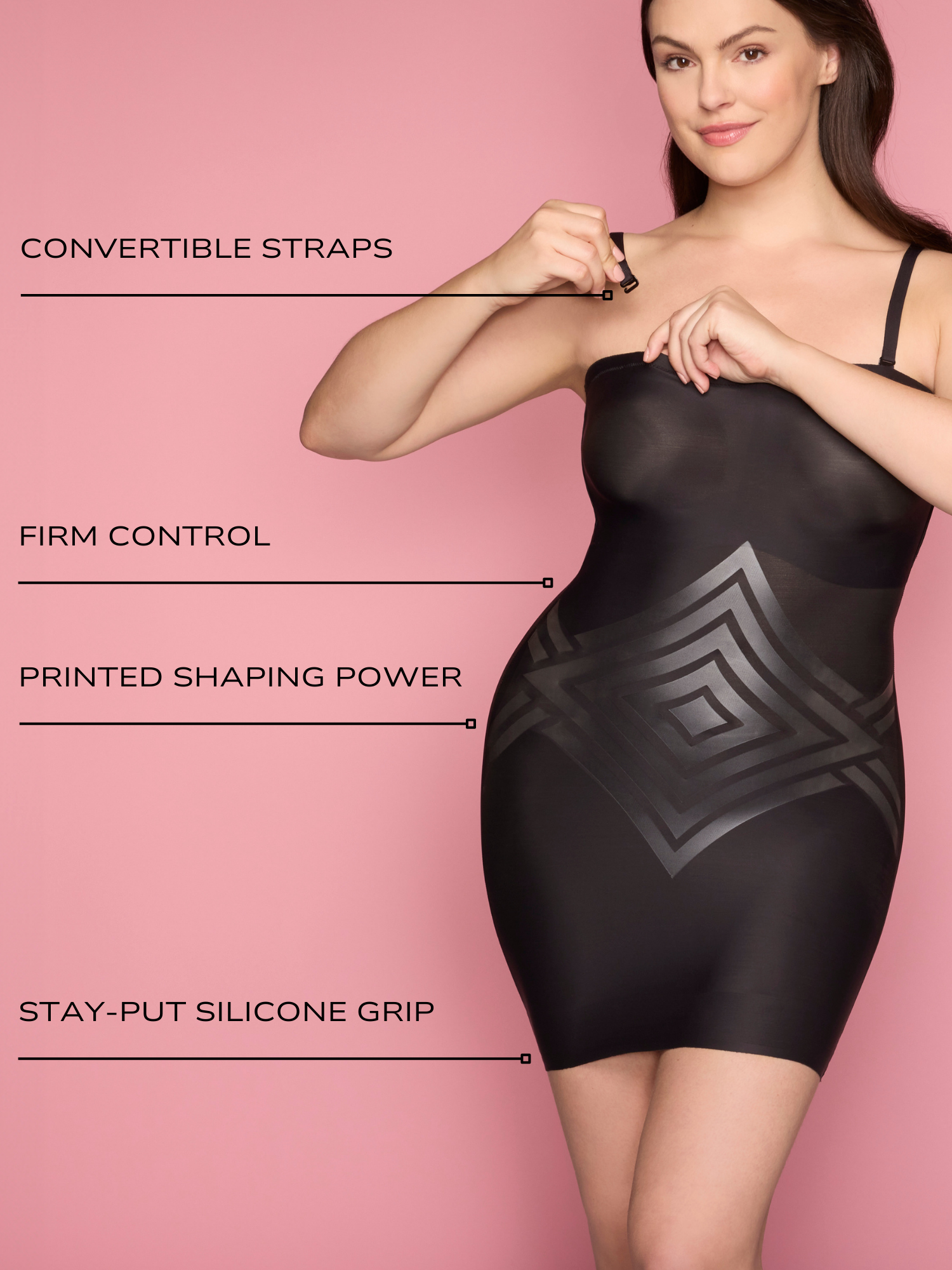 a woman wearing a black tummy control strapless slip body shaper shapewear and attaching her straps all-groups