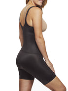 a woman wearing a black open bust tummy control body shaper