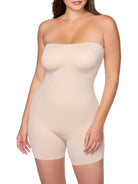 Beige strapless bodysuit worn by a model on a white background