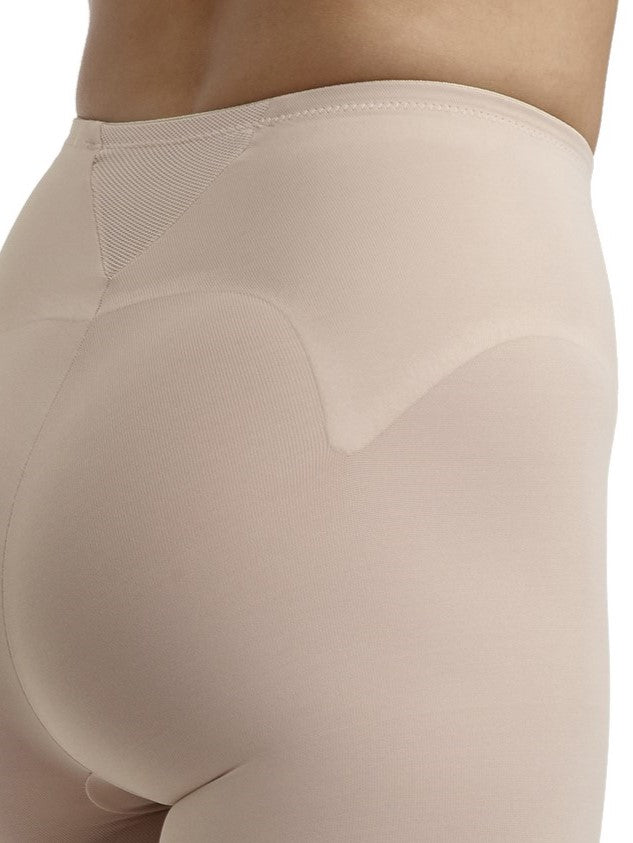 a close-up detail of a woman wearing nude tummy control leggings