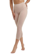 a woman wearing beige shaping leggings