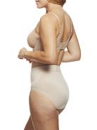 a woman wearing nude tummy control underwear shapewear