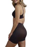 a woman wearing a black tummy control shapewear short