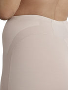 a closeup detail of a woman wearing a nude tummy control shapewear short