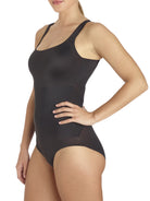 a woman wearing a black shaping bodysuit body shaper shapewear