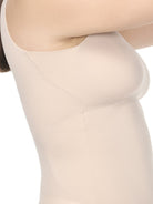 a closeup of an underarm panel of a woman wearing a nude shaping camisole shapewear