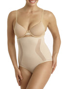 a woman wearing a beige shaping brief