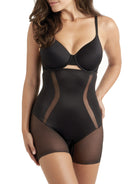 a woman wearing a black tummy control shapewear short