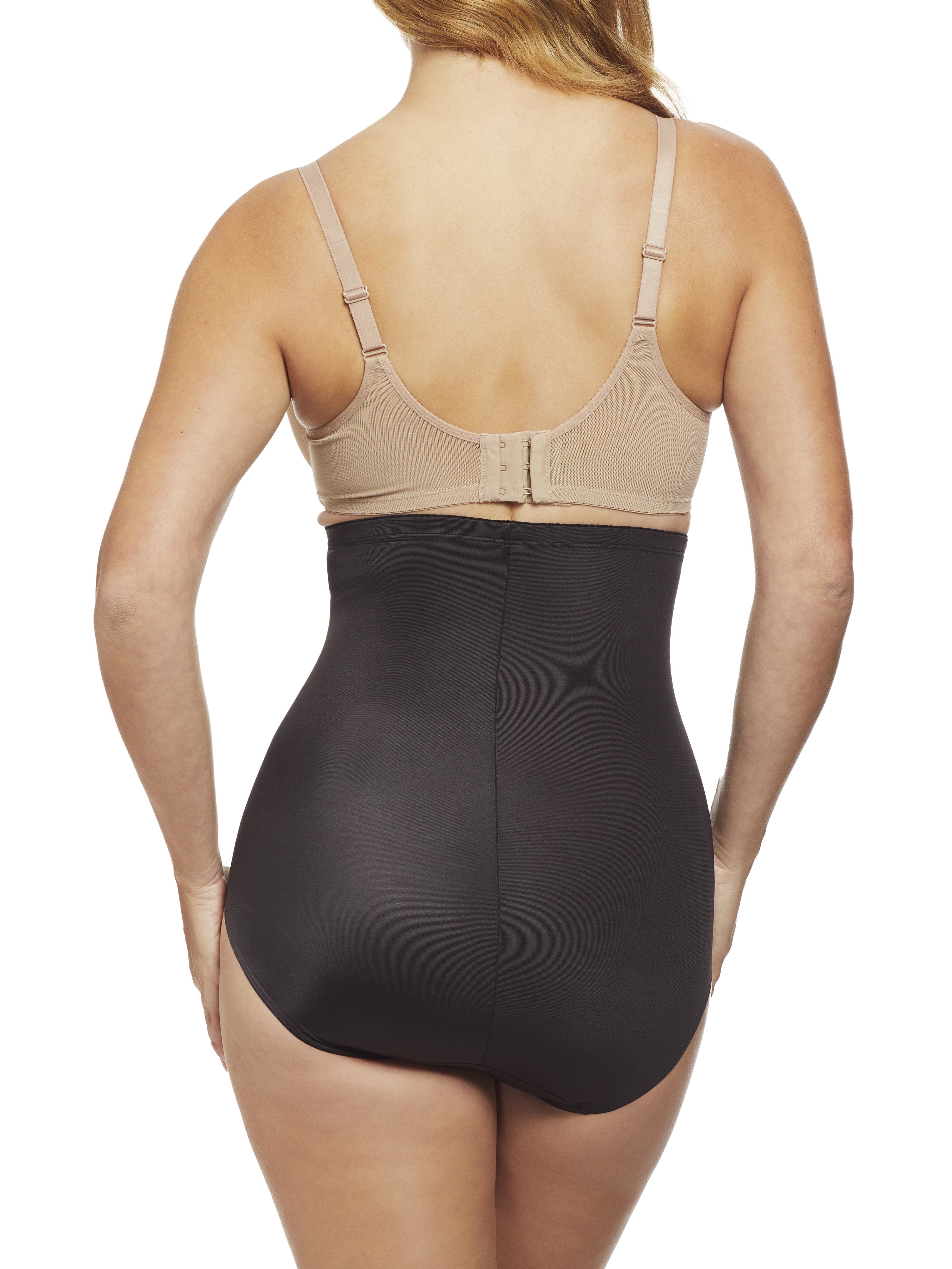 a woman wearing black high waisted tummy control underwear shapewear