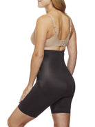 a woman wearing black tummy control shapewear shorts