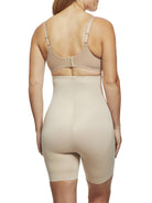 a woman wearing nude tummy control shapewear shorts