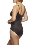 a woman wearing a black shaping bodysuit