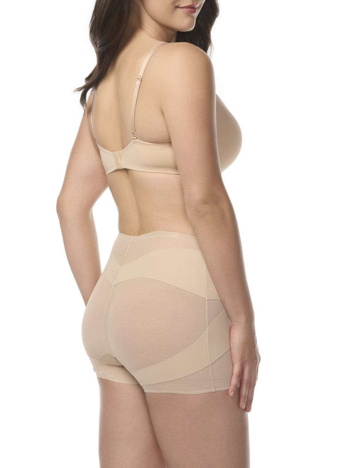 A woman wearing a sheer beige shaping boyshort with shaping panels