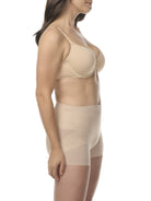 A woman wearing a sheer beige shaping boyshort with shaping panels