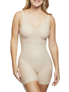 a woman wearing a beige shaping bodysuit romper