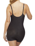 a woman wearing a black shaping bodysuit romper