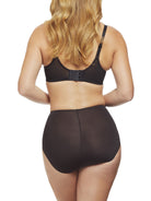 a woman wearing black tummy control underwear shapewear