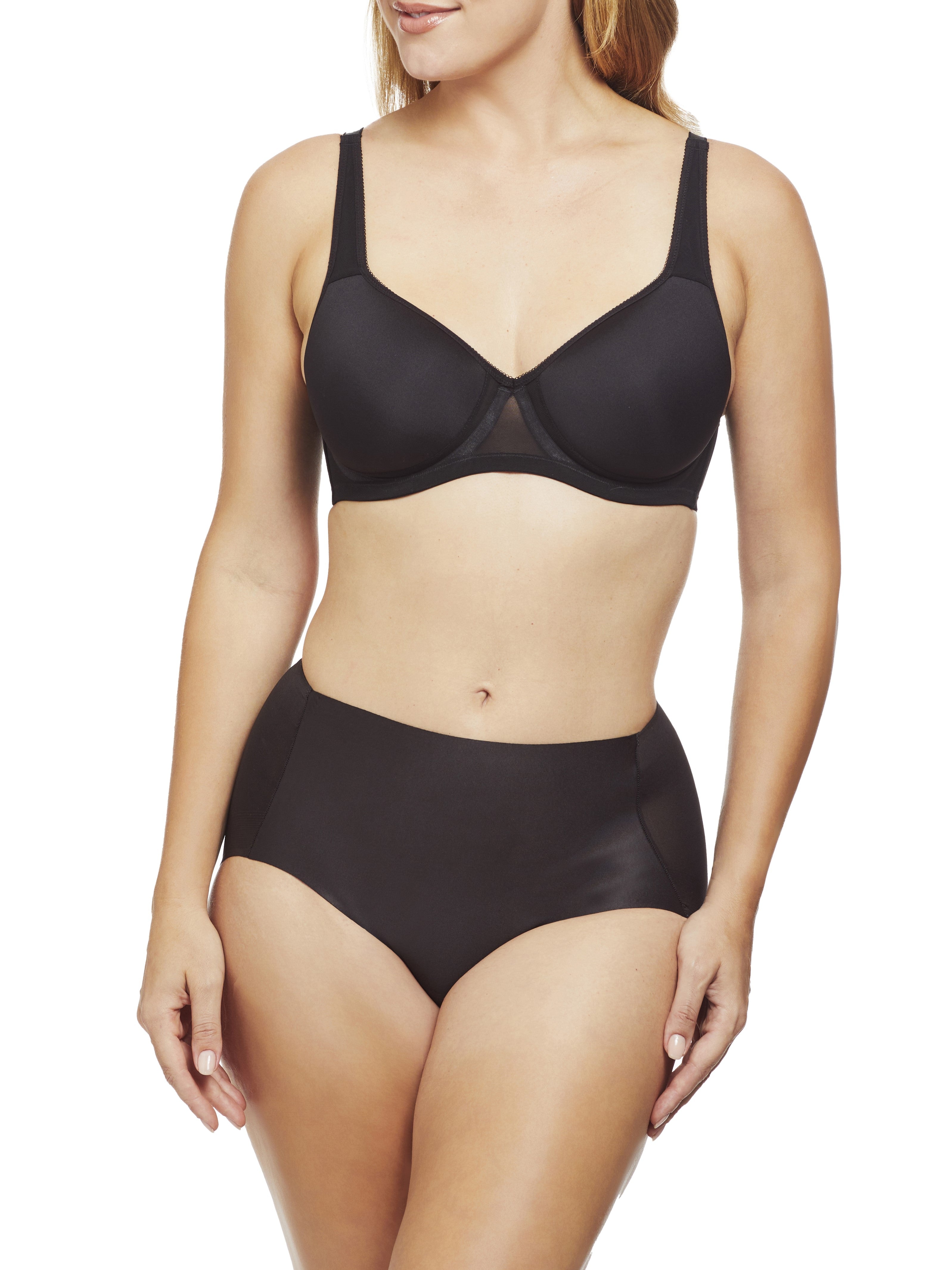 a woman wearing black tummy control underwear shapewear