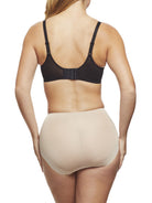 a woman wearing nude tummy control underwear shapewear