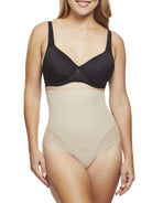 a woman wearing a beige shaping brief