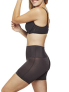 a woman wearing a black tummy control shapewear short