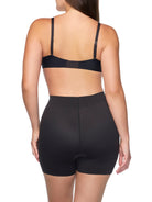 a woman wearing a black tummy control shapewear short