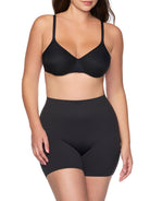 a woman wearing a black tummy control shapewear short