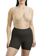 a woman wearing a black tummy control shapewear short