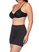 a woman wearing a black tummy control shapewear short