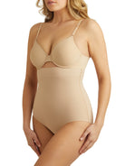 a woman wearing a beige shaping brief