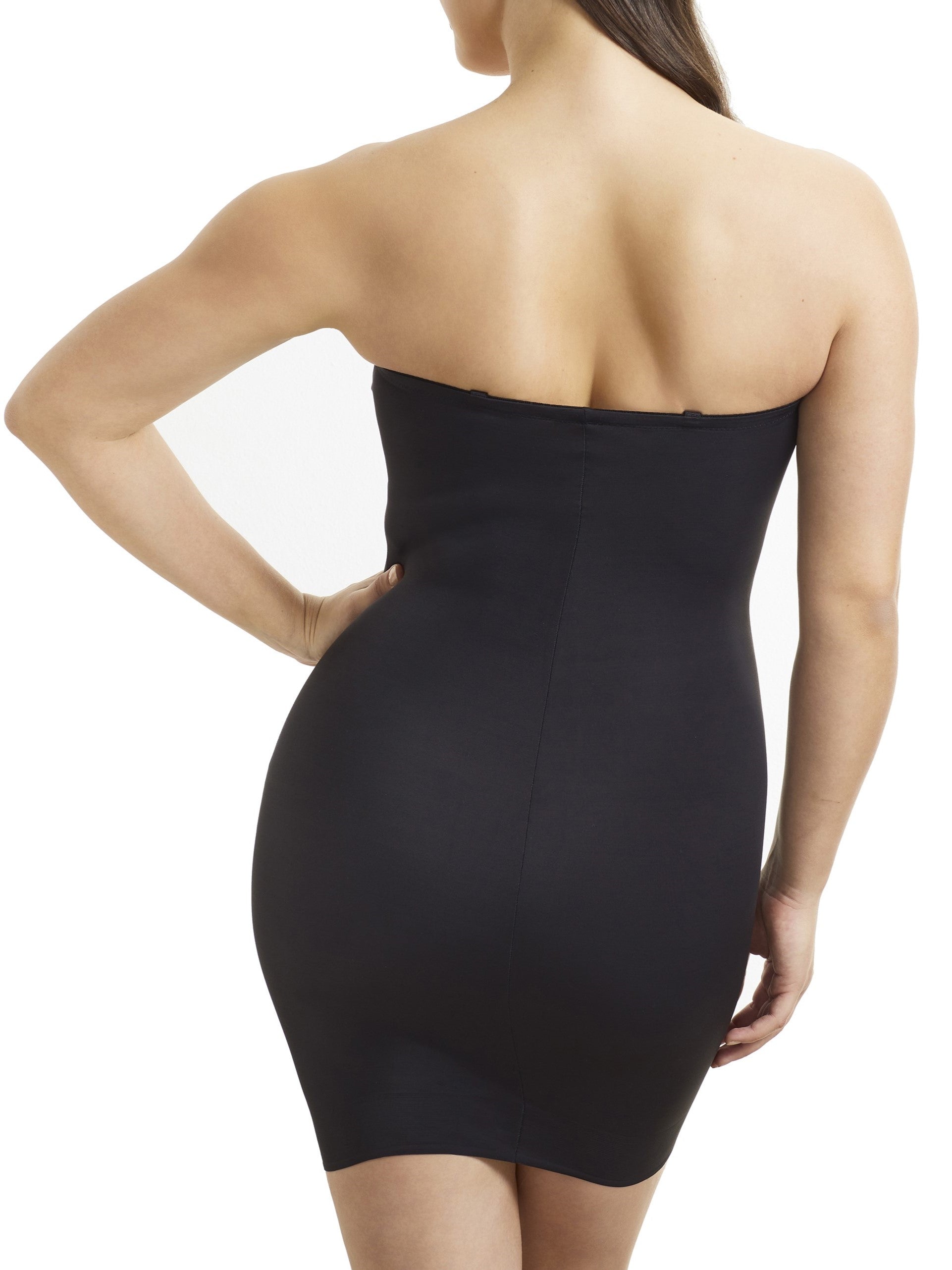 a woman wearing a black tummy control shaping slip body shaper