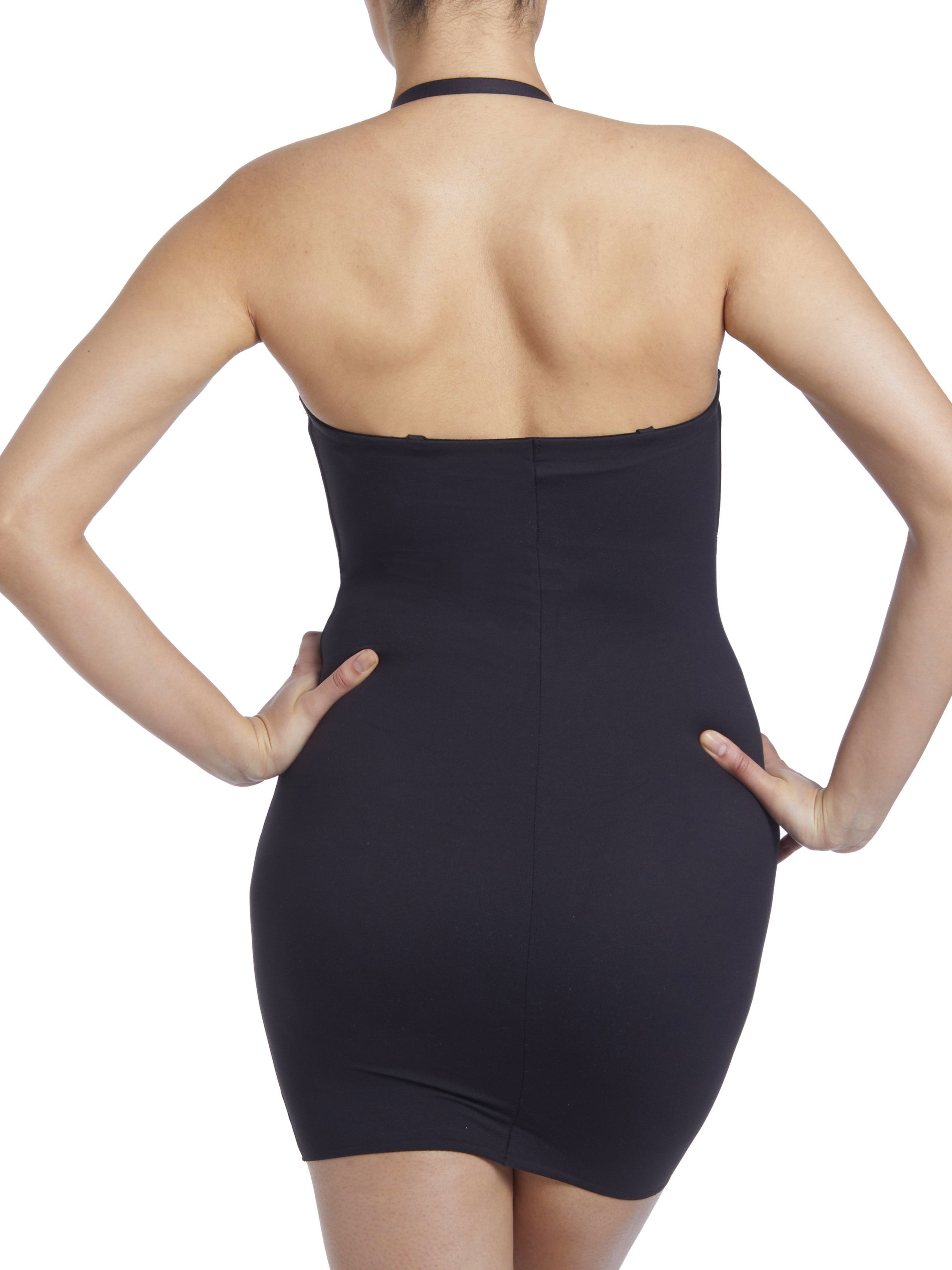 a woman wearing a black tummy control shaping slip body shaper