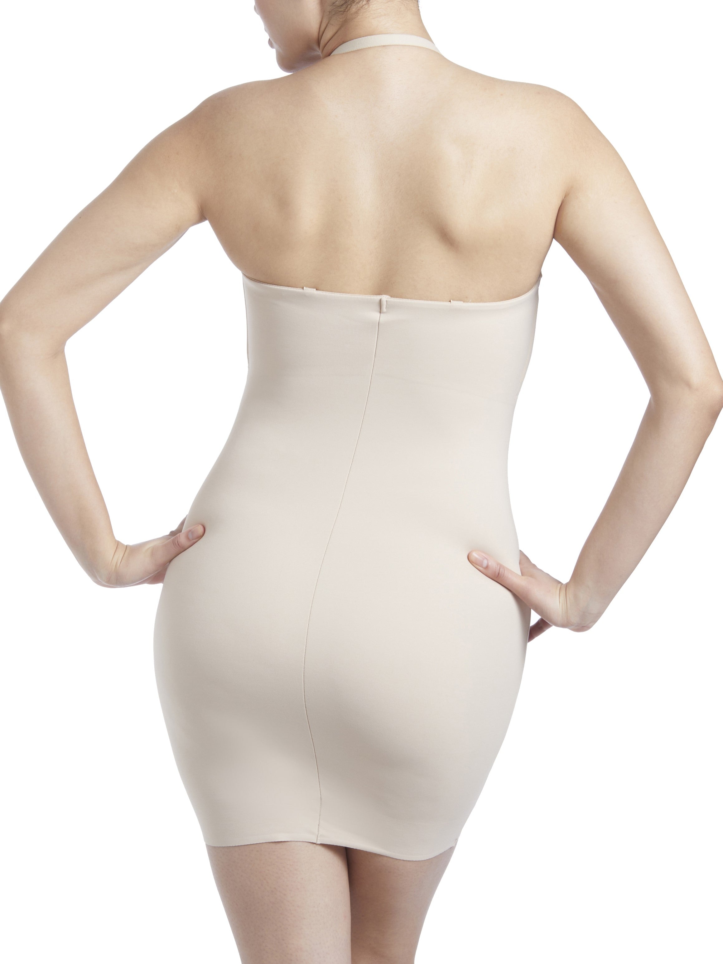 a woman wearing a beige shaping slip