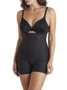 a woman wearing black high waisted tummy control shapewear shorts